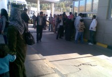 Syrian refugees queuing at the Bab Al-Hawa border crossing