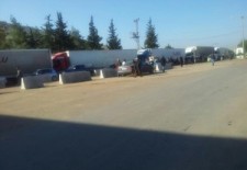 Trucks in line at the Bab Al-Hawa crossing - Facebook