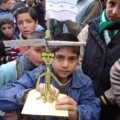 Children in Homs carrying an effigy of Syrian President being hanged - Syrian Revolution News