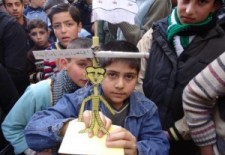 Children in Homs carrying an effigy of Syrian President being hanged - Syrian Revolution News