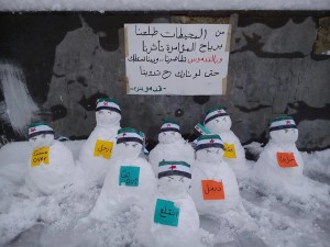 Snowmen demonstrate against the regime in the town of Al-Qadmus in he governorate of Tatrtus near the coast - Facebook