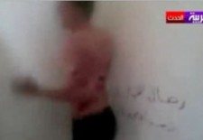 A detainee being beaten by Syrian Army soldiers. Credit: YouTube