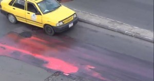 A street dyed red in protest of shelling the Aleppo University in January. Credit: YouTube.