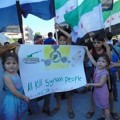 A banner held during a demonstration in Homs late August. Credit: "Lens Young Homsi" page on Facebook