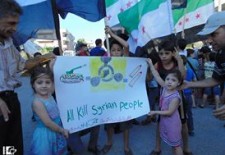 A banner held during a demonstration in Homs late August. Credit: "Lens Young Homsi" page on Facebook