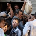 Syrians line up for bread. Credit: Orient News