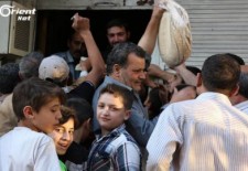 Syrians line up for bread. Credit: Orient News