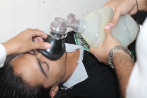 A patient with breathing difficulties caused following an air strike receives treatment at the field hospital where Marwan works. Photography by Abdul Karim Jaafar.