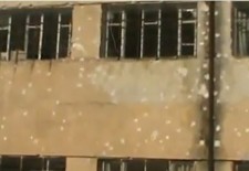 A school damaged by the fighting between the oppsotion and government forces. Credit: YouTube