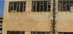 A school damaged by the fighting between the oppsotion and government forces. Credit: YouTube