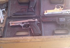 Pistols are displayed at a market in Qamshli. Photography by Vyan M
