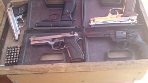 Pistols are displayed at a market in Qamshli. Photography by Vyan M