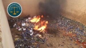 This photo, published by the Judicial Sharia Committee in Deir al-Zor, allegedly shows the destruction of liquor that was on its way to "Assad's militias". Credit: Facebook