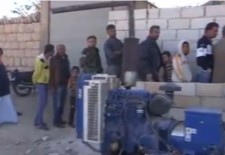 People in Kfar Nabel queue in front of a bakery managed by Al-Huda charity organisation. Credit: YouTube.