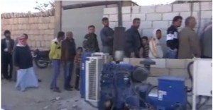 People in Kfar Nabel queue in front of a bakery managed by Al-Huda charity organisation. Credit: YouTube.