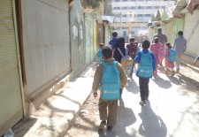 Young students on their way out of school in Raqqa. Photography by Abdel Karim Jaafar.