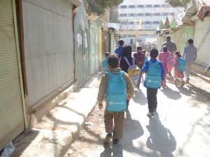 Young students on their way out of school in Raqqa. Photography by Abdel Karim Jaafar.