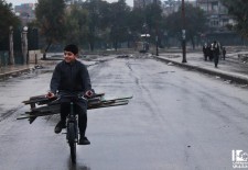 A child in Aleppo transports wood on a bicycle. Photo credit: Lens Young Halabi page on Facebook.