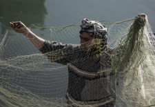Before embarking on the trip, the fishermen set out their nets.