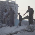 This man looks at what remains of his building.