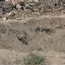 A large crater left by an air raid in the town of Bouleil in 2012 - YouTube/alfurat2freedom