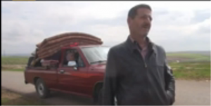 A resident of Khan Shaykhoun in Idlib province flees the fighting - YouTube/Orient News