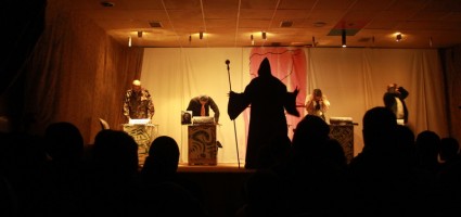 The Phantom gives instructions to his corrupt agents.