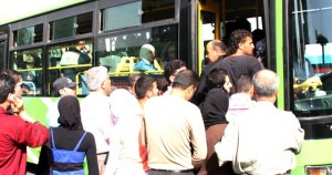 A long queue at a bus stop in Damascus. Damascus Bureau