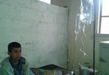 A child receiving treatment at the Health Care Centre in Bouleil. Photograph: Ahmad al-Bouleily.