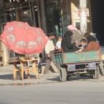 A transportation contraption accommodating all members of the family including women in the Maadi Neighborhood in Aleppo. Photographer: Salah al-Ashqar