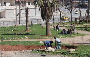 Al-Ansari neighbourhood: Some families try to relax in one of the last remaining parks. Photo: Salah al-Ashqar